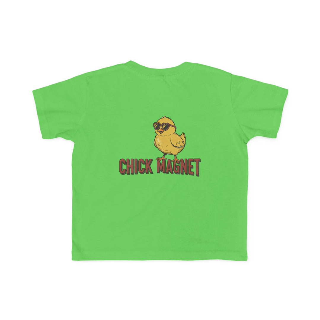 Chick Magnet Toddler Tee featuring a playful yellow chick with heart-shaped sunglasses and punny caption on a bright green T-shirt, available in toddler sizes.