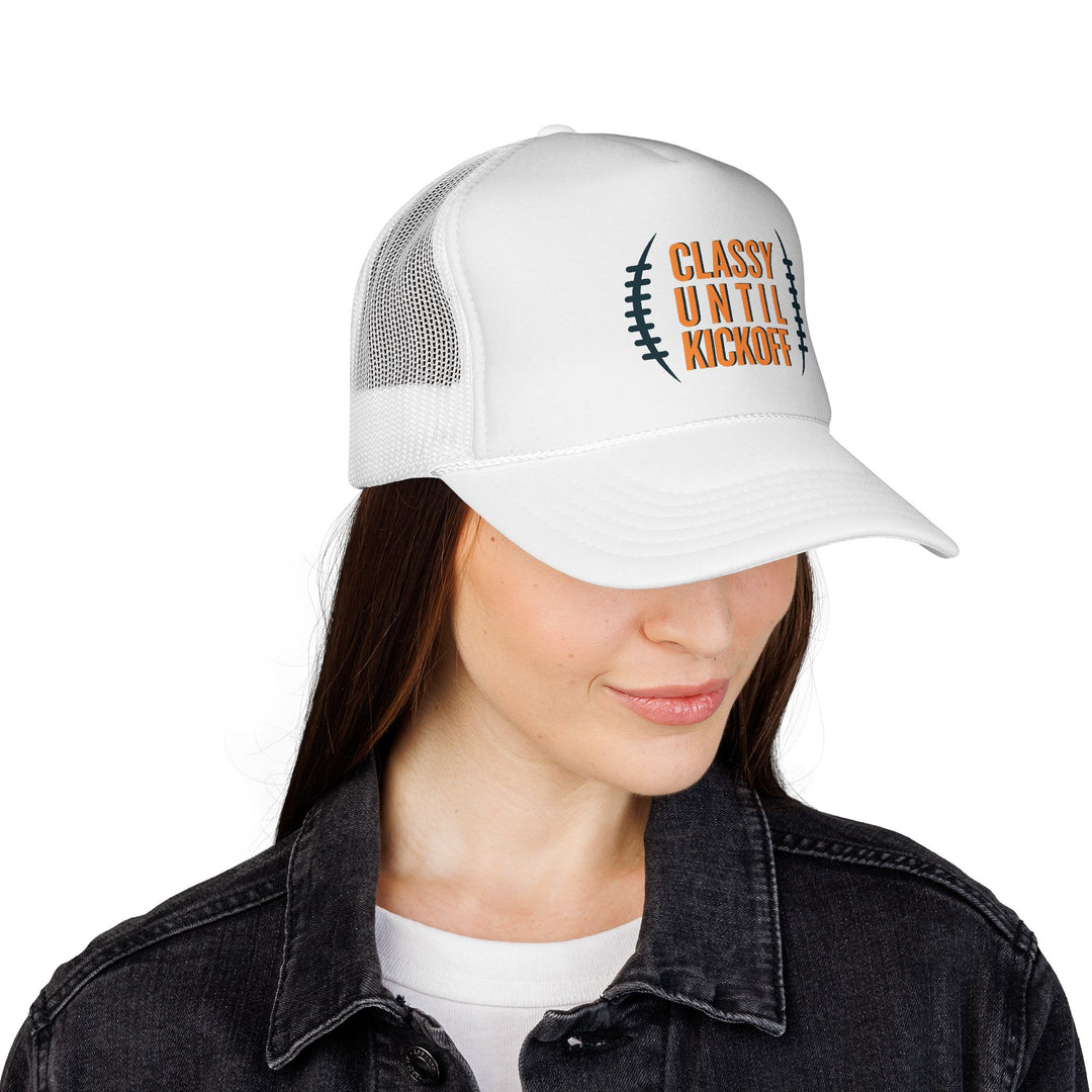 Woman wearing Bronco Trucker Cap with CLASSY UNTIL KICKOFF and football lace graphic, featuring a durable mesh back and adjustable snap closure.