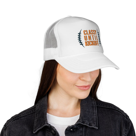 Woman wearing Bronco Trucker Cap with CLASSY UNTIL KICKOFF and football lace graphic, featuring a durable mesh back and adjustable snap closure.