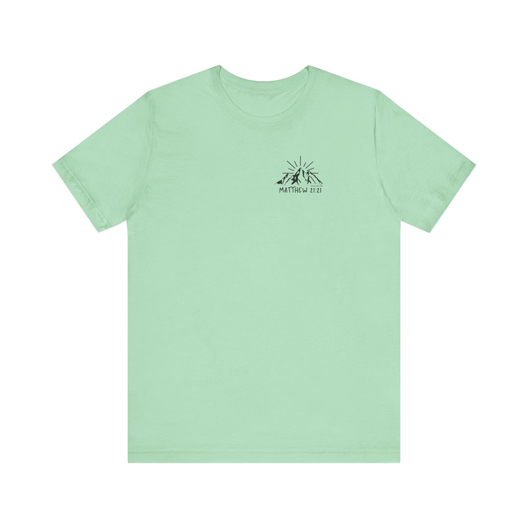 A green tee with a mountain logo, embodying the Faith Can Move Mountains Tee by Worlds Worst Tees. Unisex, 100% cotton, retail fit, tear away label, and ribbed knit collars for a beloved favorite.