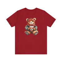 Old Money Christmas Bear Tee featuring a teddy bear in winter attire holding a festive coffee cup, printed on a classic red unisex jersey T-shirt.