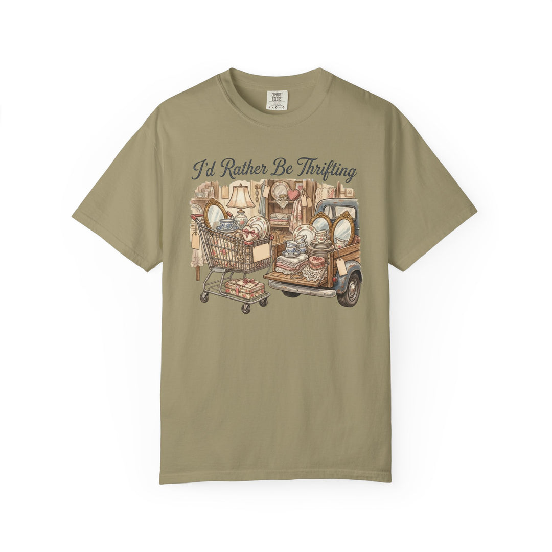 “I’d Rather Be Thrifting” Tee with whimsical thrift-themed illustration, featuring a shopping cart and pickup truck overflowing with vintage finds, perfect for casual wear.