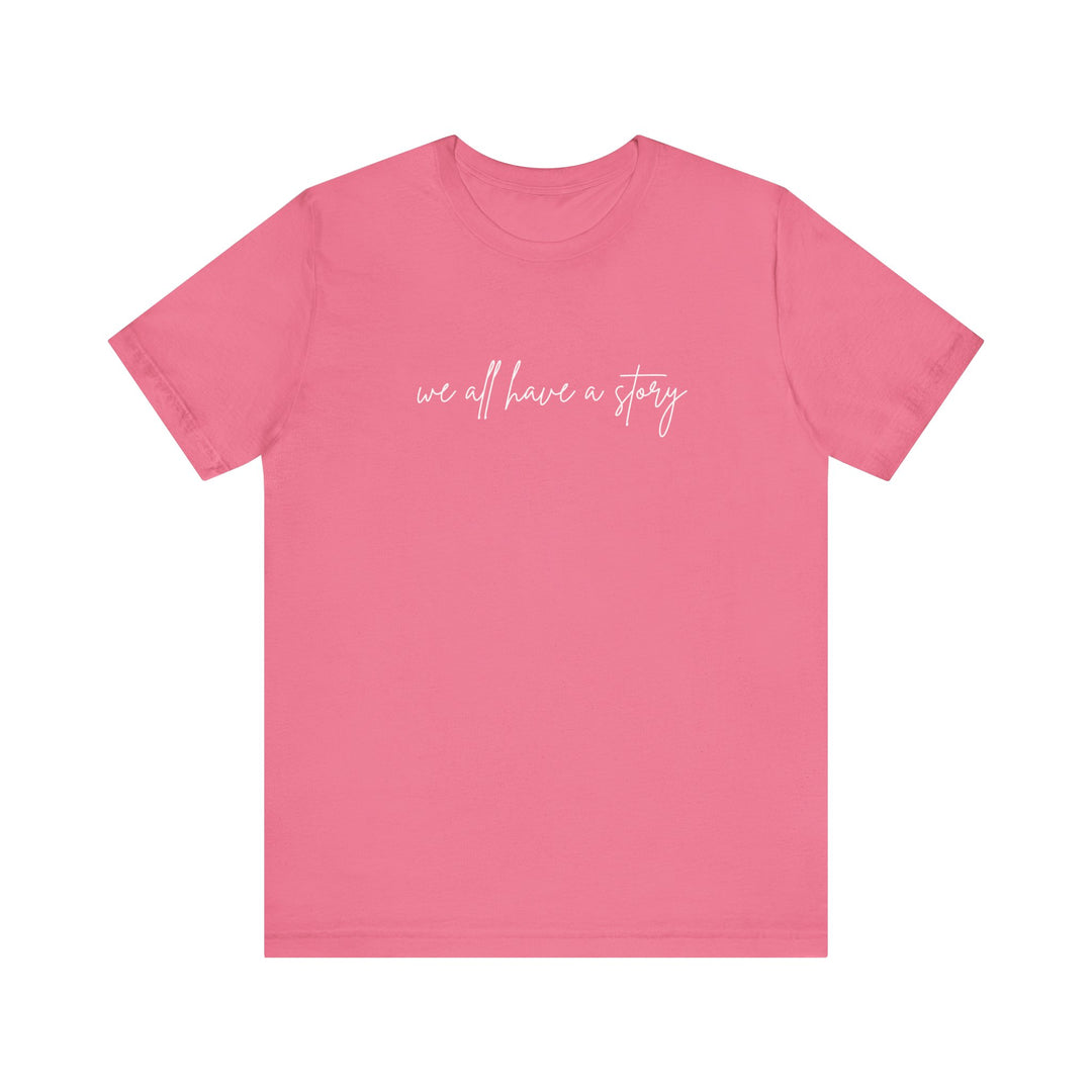 We all have a Story Tee: Pink unisex jersey short sleeve t-shirt featuring white text, perfect for casual wear and showcasing a soft, comfortable fit.