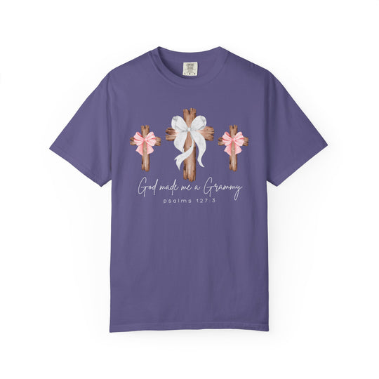 Purple tee with three wooden crosses, central cross with white bow, text 'God made me a Grammy,' Psalm 127:3; soft, durable, relaxed fit.