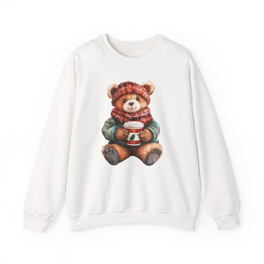 White crew-neck sweatshirt featuring Old Money Bear design: teddy bear in winter attire holding a festive cup, combining comfort with unique, whimsical style.