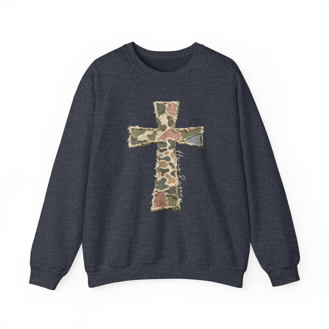 Heis Risen Cross Crew: Navy crewneck sweatshirt featuring a patchwork camouflage cross with He is Risen inscription, exemplifying comfort and style from Faith Family Designs.
