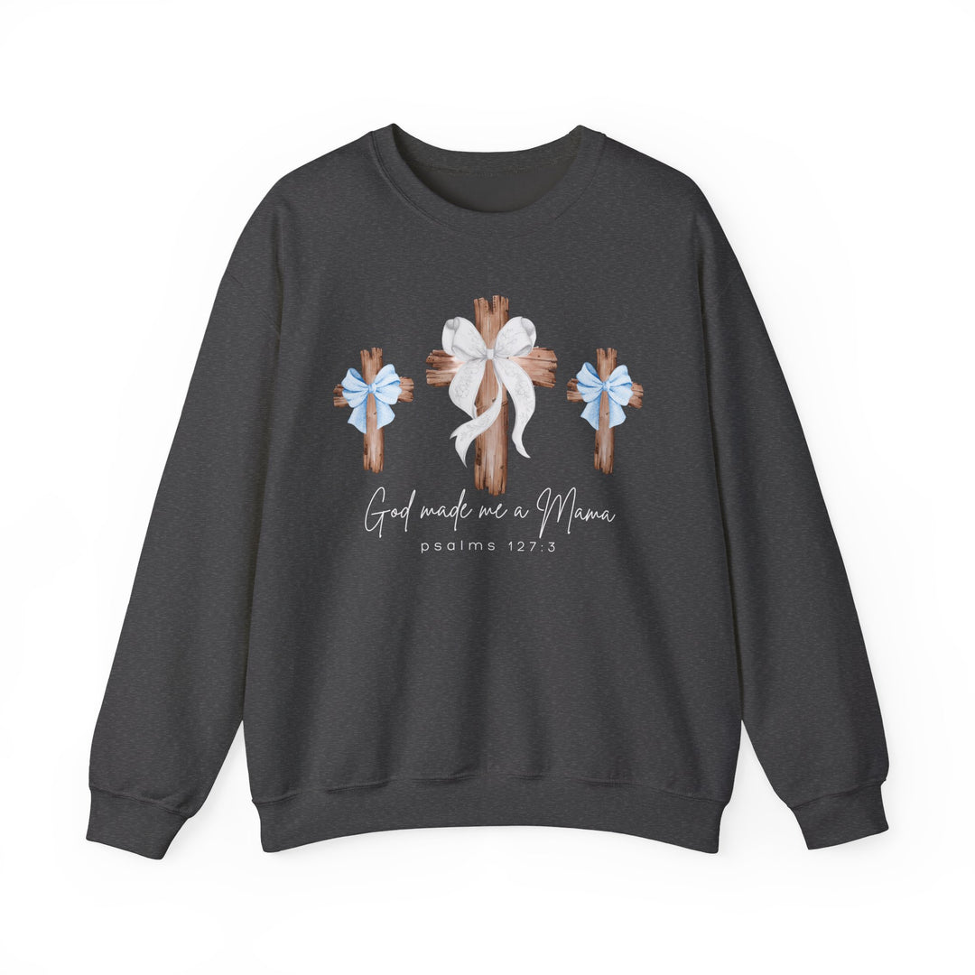 Dark-charcoal sweatshirt with God Made Me a Mama design, featuring three crosses with bows. Comfortable unisex fit, polyester-cotton blend, ribbed collar.