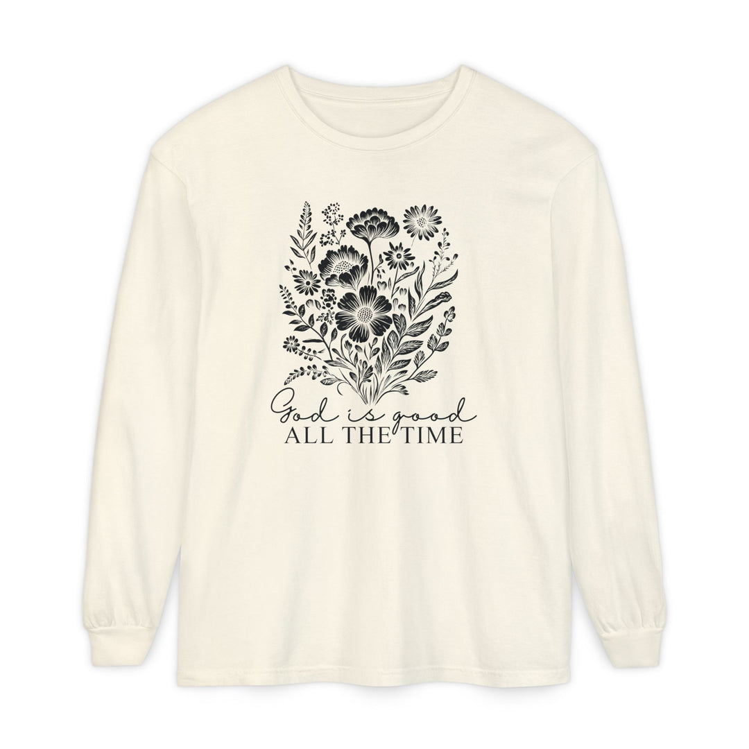 Cream-colored long-sleeve T-shirt featuring a black floral graphic and God is good ALL THE TIME text, emphasizing comfort and style from Faith Family Designs.