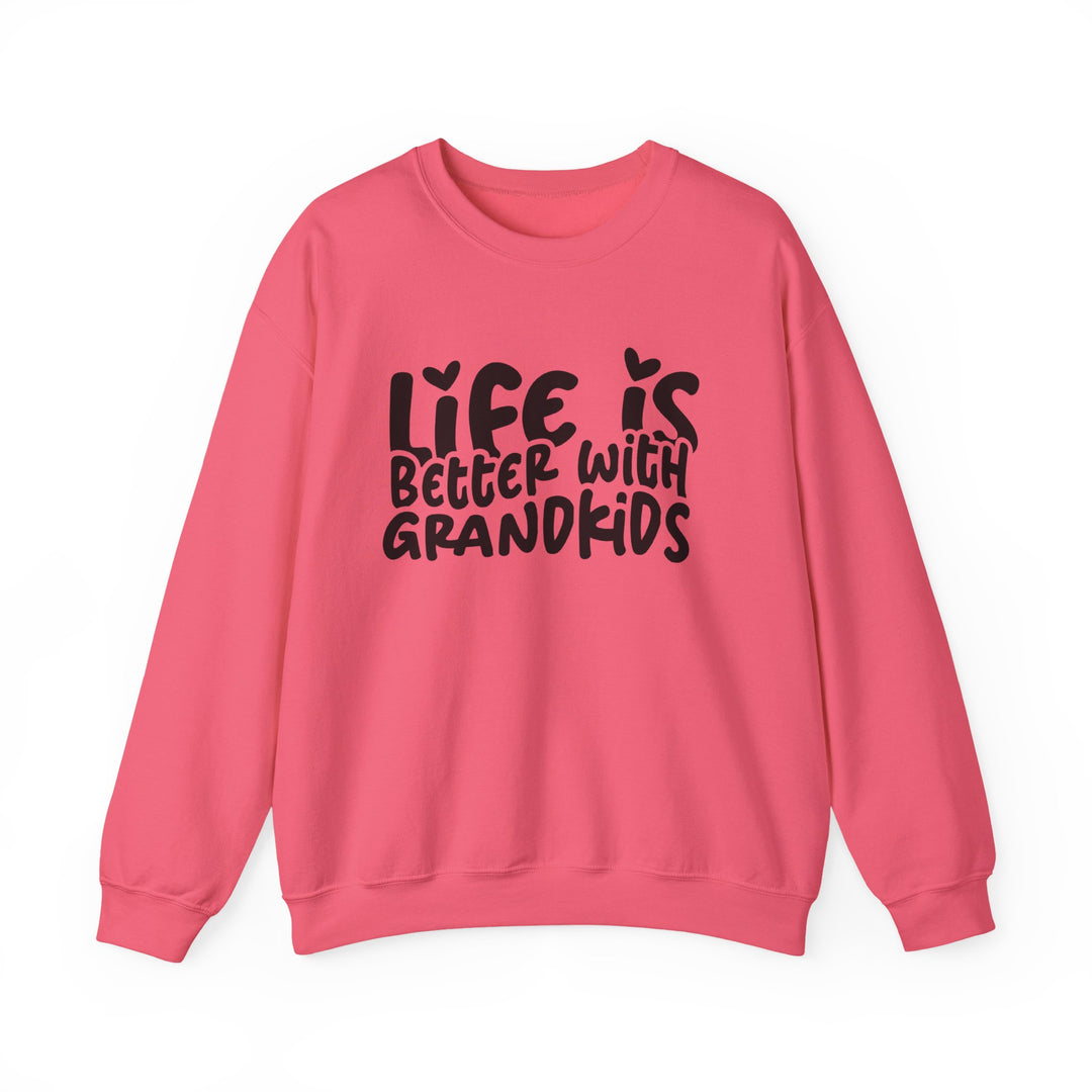 Coral-pink sweatshirt with Life is better with grandkids slogan, ribbed collar, and loose fit, designed by Faith Family Designs.