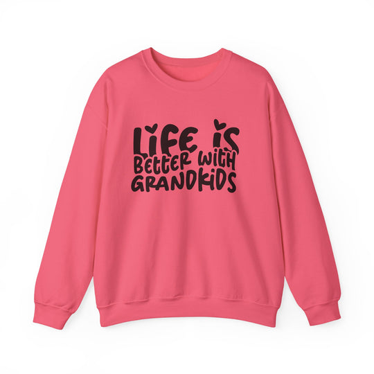Coral-pink sweatshirt with Life is better with grandkids slogan, ribbed collar, and loose fit, designed by Faith Family Designs.