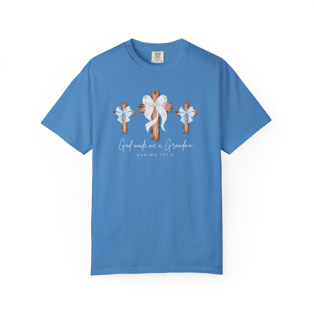 Light-blue Comfort Colors tee with God Made Me a Boy Grandma graphic, featuring three rustic crosses and Psalm 127:3 script, perfect for faith-centered wardrobes.