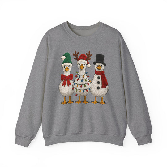 Light-gray crewneck sweatshirt featuring three cartoon ducks in festive attire, perfect for holiday cheer and comfort with a durable, cozy polyester-cotton blend.
