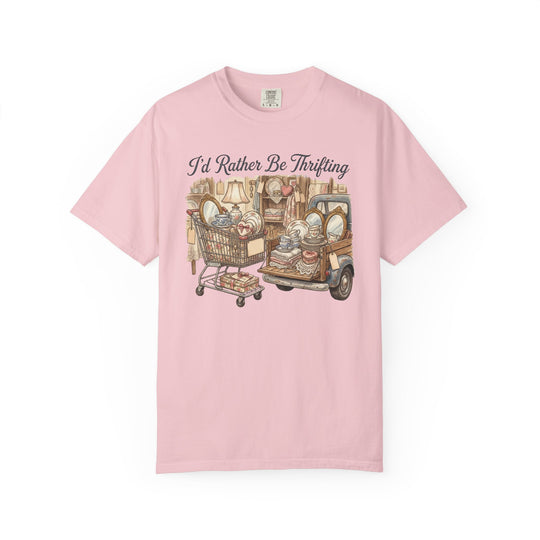 Light-pink I'd Rather Be Thrifting tee featuring a vintage thrift-haul graphic with shopping cart, pickup truck, and eclectic items; relaxed fit, 100% cotton.