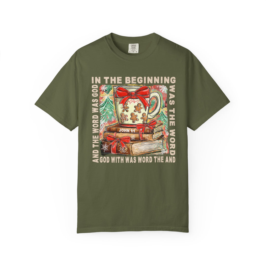 In the Beginning Tee features a Christmas-themed Bible-verse design with festive mug, books, and stylized trees, highlighting John 1:1's words.