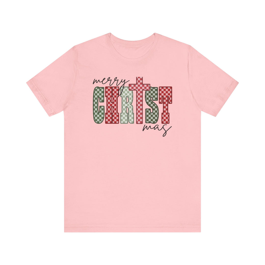 Light-pink Christmas Tee with a festive Merry Christmas design, featuring block letters and a cross-shaped T, crafted from soft cotton for comfort.