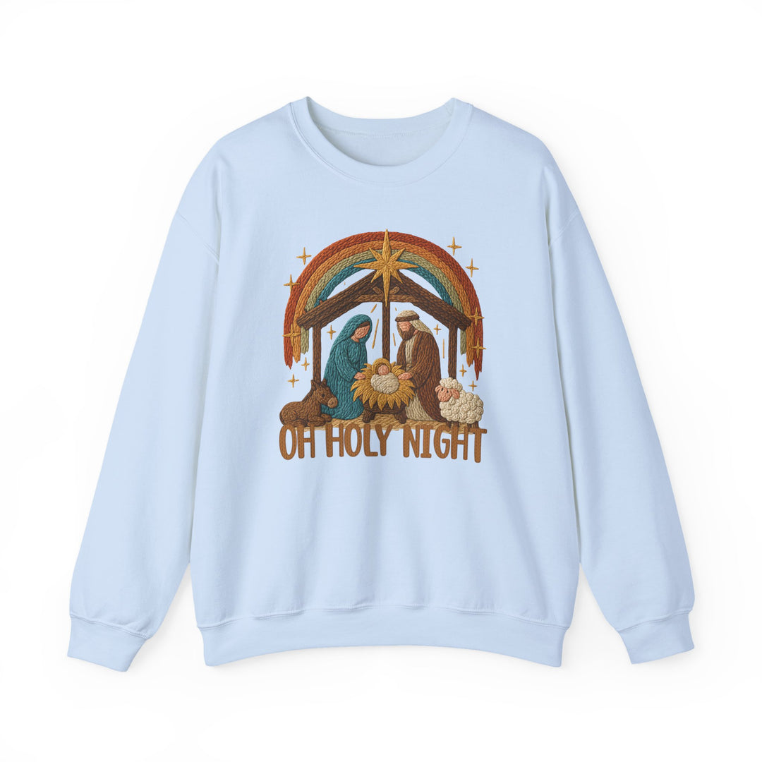 Oh Holy Night Crew: Light-blue crewneck sweatshirt with an embroidered Nativity scene, featuring Mary, Joseph, baby Jesus, and OH HOLY NIGHT text. Cozy polyester-cotton blend.