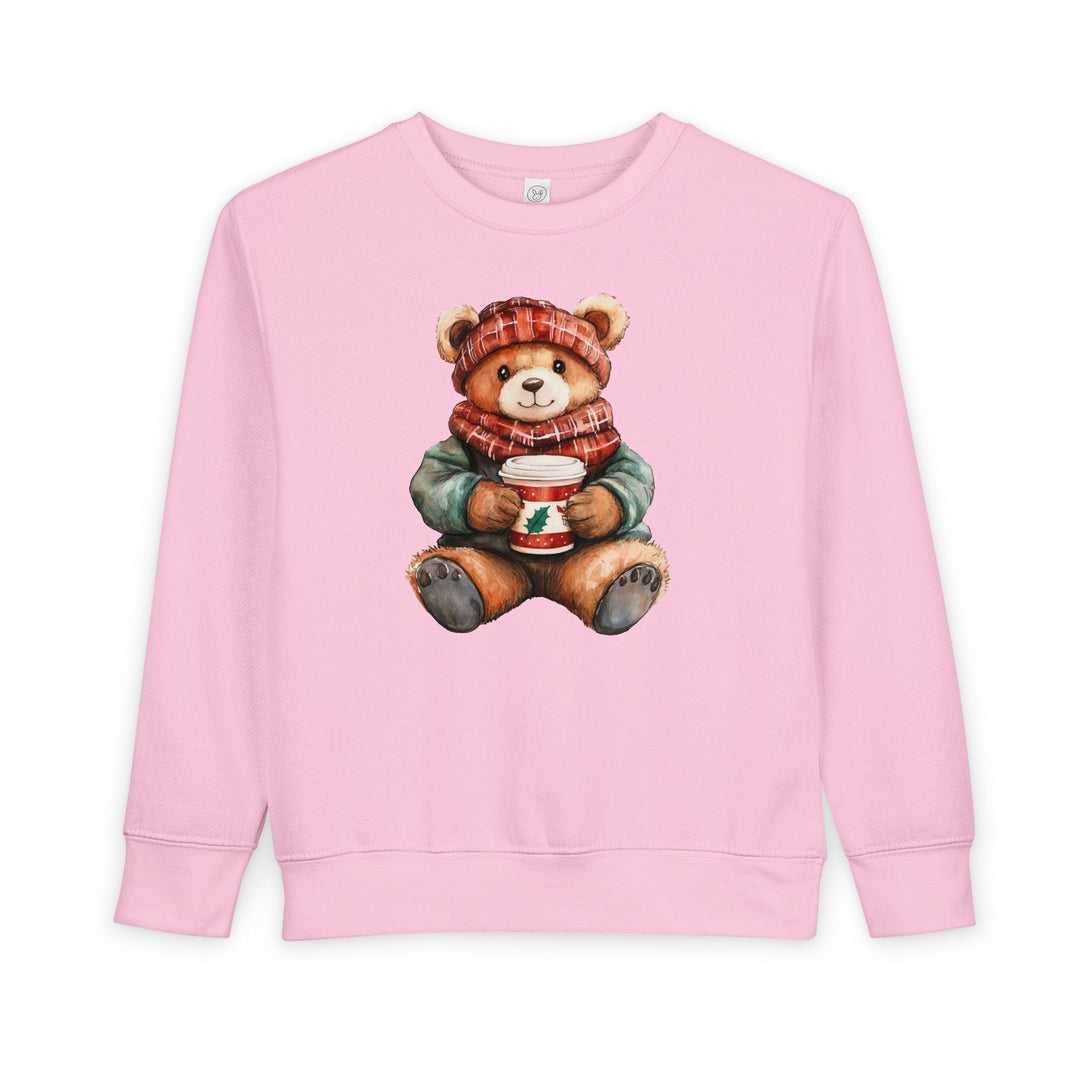 Light-pink crewneck sweatshirt, Old Money Bear Crew, featuring a winter-dressed teddy bear with a plaid hat, scarf, and holly cup, for toddlers' comfort.