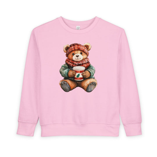 Light-pink crewneck sweatshirt, Old Money Bear Crew, featuring a winter-dressed teddy bear with a plaid hat, scarf, and holly cup, for toddlers' comfort.
