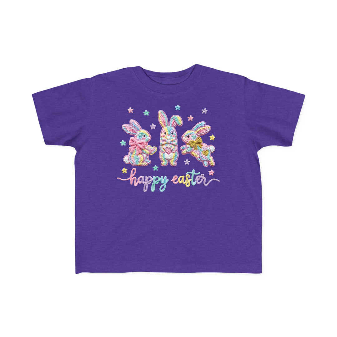 Easter Bunny Toddler Tee with three pastel bunnies and happy easter text, perfect for kids’ sensitive skin, from Faith Family Designs.