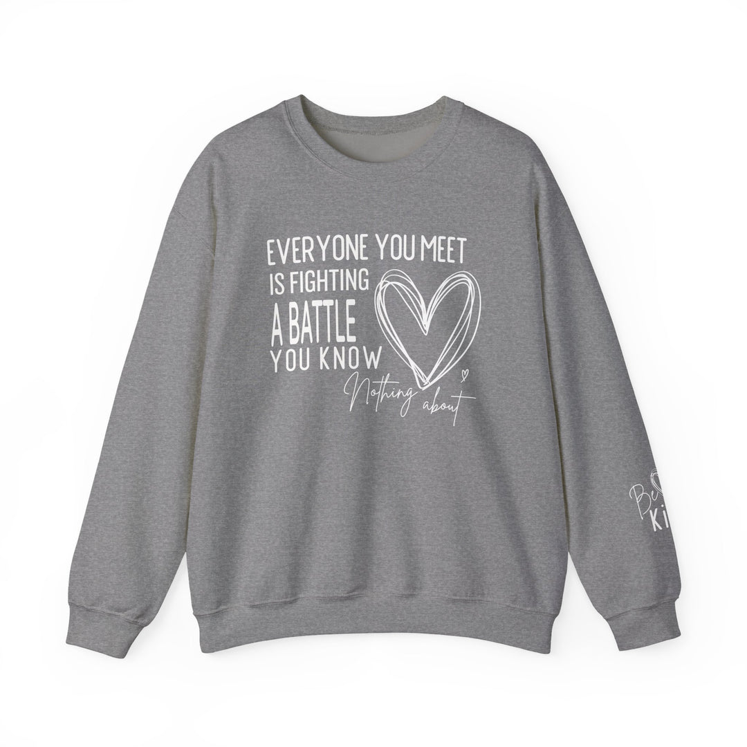 Heather-gray crewneck sweatshirt titled Fighting a Battle Crew with motivational quote and heart graphic, featuring Be Kind on the sleeve. Cozy, durable, unisex fit.