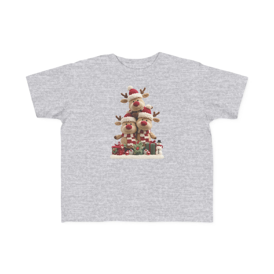 Reindeer Tree Toddler Tee featuring plush reindeer in Santa hats and scarves, surrounded by gifts and a snowman, perfect for sensitive toddler skin.