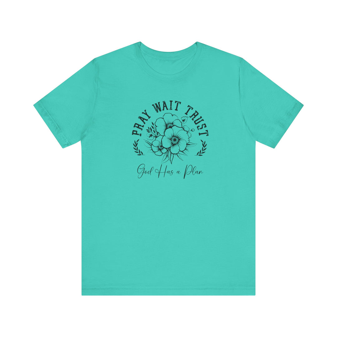 Pray Wait Trust Tee featuring a black graphic and floral design on a blue background, crafted from soft cotton with ribbed knit collars and taped shoulders.
