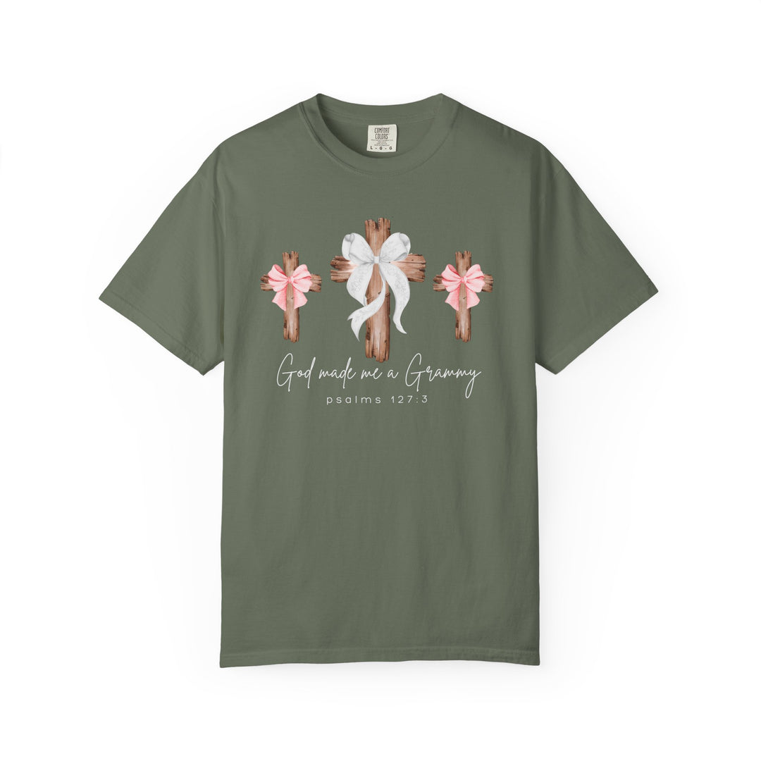 Olive-green God Made Me a Grammy Tee featuring three wooden crosses with bows and scriptural text, crafted from soft, garment-dyed, 100% ring-spun cotton.