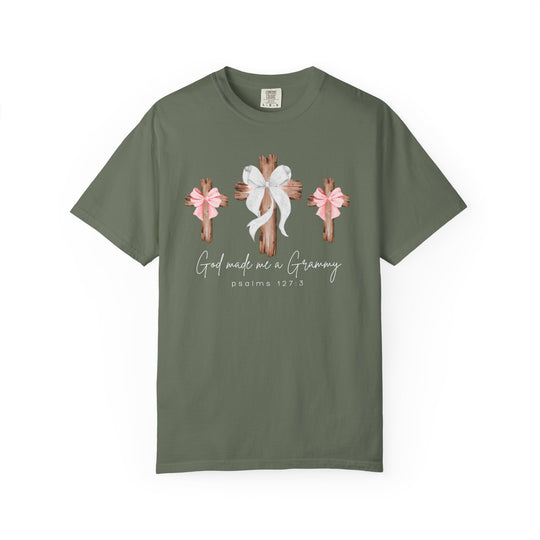Olive-green God Made Me a Grammy Tee featuring three wooden crosses with bows and scriptural text, crafted from soft, garment-dyed, 100% ring-spun cotton.