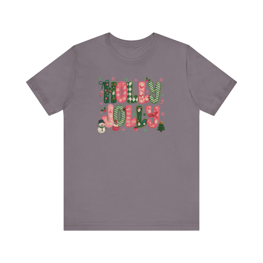 Holly Jolly Tee with festive lettering and holiday motifs like snowflakes, candy canes, and a snowman, showcasing Faith Family Designs' unique graphic style.