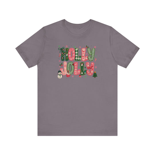 Holly Jolly Tee with festive lettering and holiday motifs like snowflakes, candy canes, and a snowman, showcasing Faith Family Designs' unique graphic style.