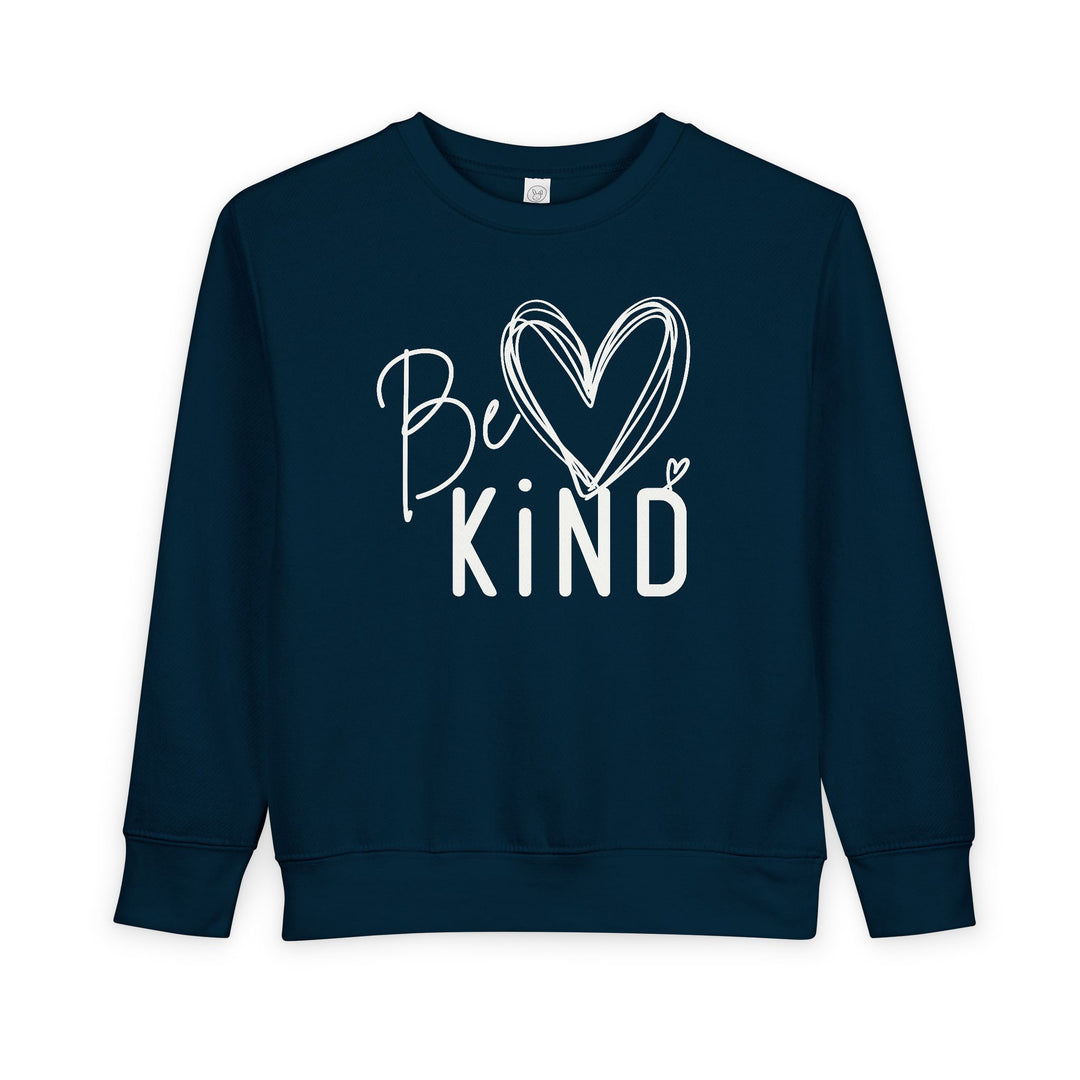 Navy-blue Be Kind Toddler Crew sweatshirt with a white hand-lettered slogan, featuring a heart-topped i for a friendly, uplifting look.