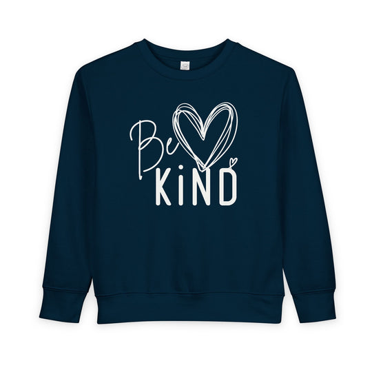 Navy-blue Be Kind Toddler Crew sweatshirt with a white hand-lettered slogan, featuring a heart-topped i for a friendly, uplifting look.