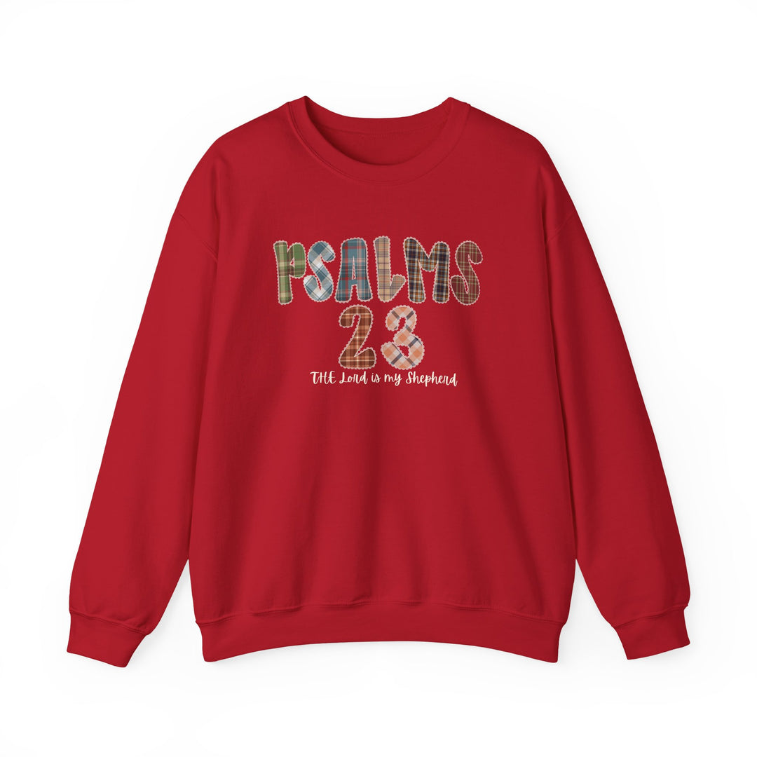 Red crewneck sweatshirt with PSALMS 23 in plaid patch letters and The Lord is my Shepherd in white script, showcasing comfort and faith-themed design.