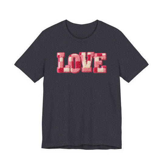 Love Tee: Charcoal-gray short-sleeve shirt with LOVE in pink, red, and cream chenille patches. Cozy texture on soft cotton, unisex fit, ideal for casual wear.