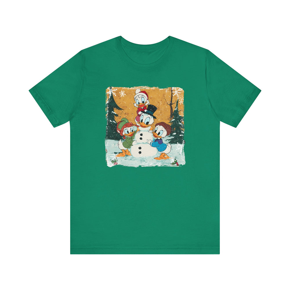 Duck Snowmen Tee features Donald Duck and nephews building a snowman in a snowy forest, capturing festive charm on a classic, soft cotton crew-neck T-shirt.