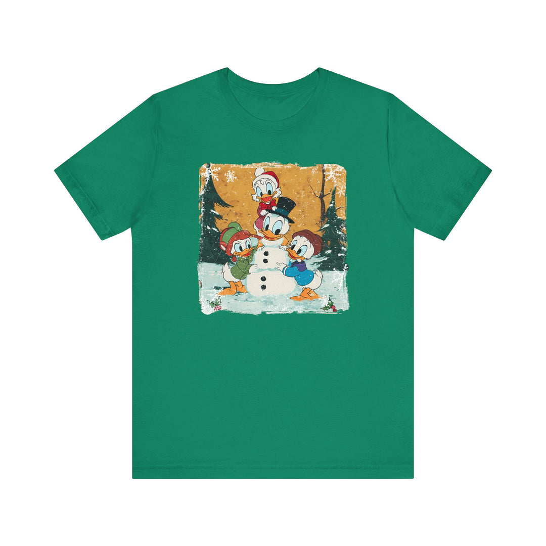 Duck Snowmen Tee features Donald Duck and nephews building a snowman in a snowy forest, capturing festive charm on a classic, soft cotton crew-neck T-shirt.