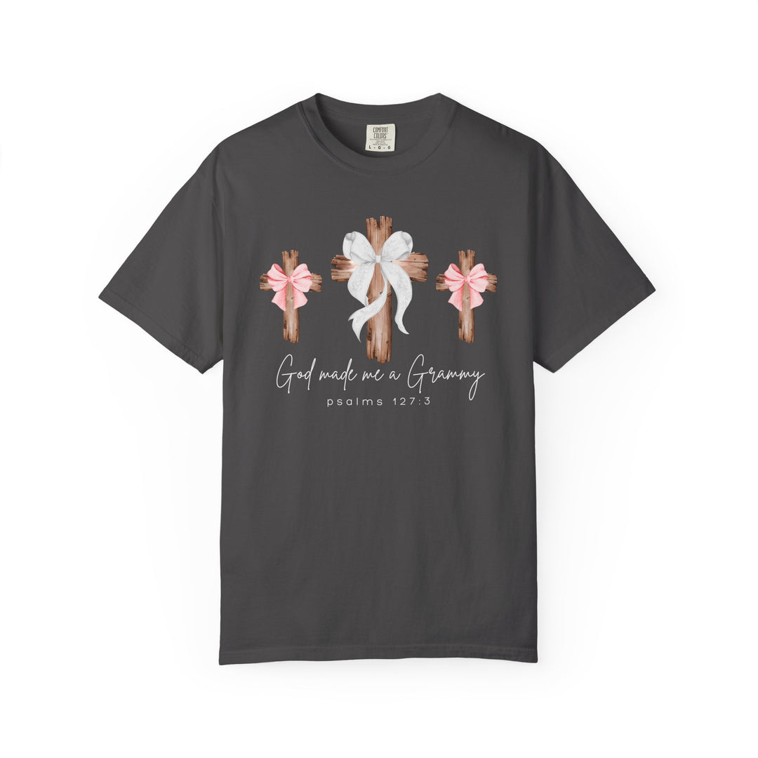God Made Me a Grammy Tee with rustic wooden crosses and heartfelt script, highlighting Psalms 127:3 on a soft, relaxed-fit charcoal-gray shirt.
