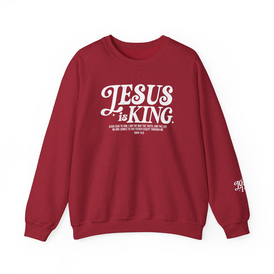 Jesus is King Crew unisex red sweatshirt with white text, offering a comfortable fit with ribbed collar, made of polyester-cotton blend for lasting design clarity.