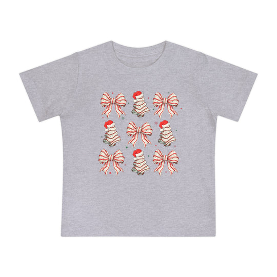 Cookies and Bows Baby Tee: Heather-gray T-shirt for infants, featuring a grid of festive red-and-white bows and Santa-topped tree motifs, perfect for holiday style.