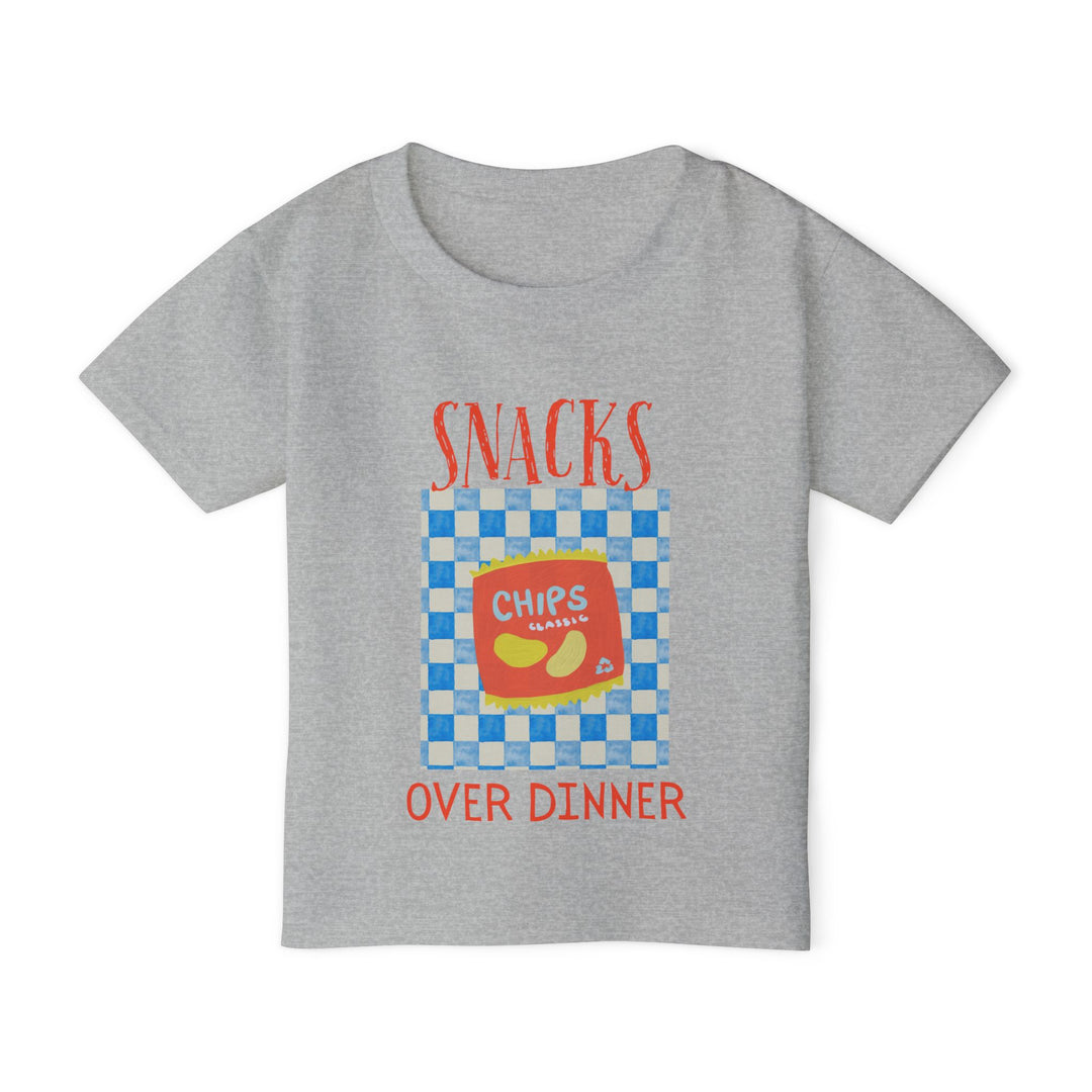 Heavy Cotton™ Toddler T-shirt featuring Snacks Over Dinner graphic with a chips illustration, blending playful style with eco-friendly, soft-touch cotton fabric.