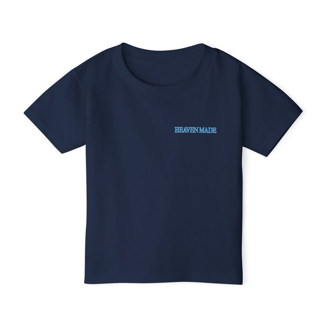 Heavy Cotton™ Toddler T-shirt in navy with HEAVEN MADE light-blue chest print, offering softness and comfort with eco-friendly cotton from Faith Family Designs.
