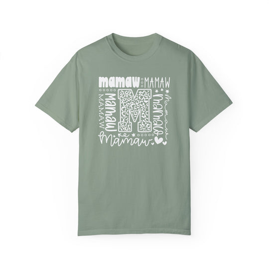 Comfort Colors 1717 Mamaw Tee: Green t-shirt with white 'M' logo, ring-spun cotton, relaxed fit, crew neckline, durable double-needle stitching, no side-seams. Available in various sizes. Ethically made in the US.