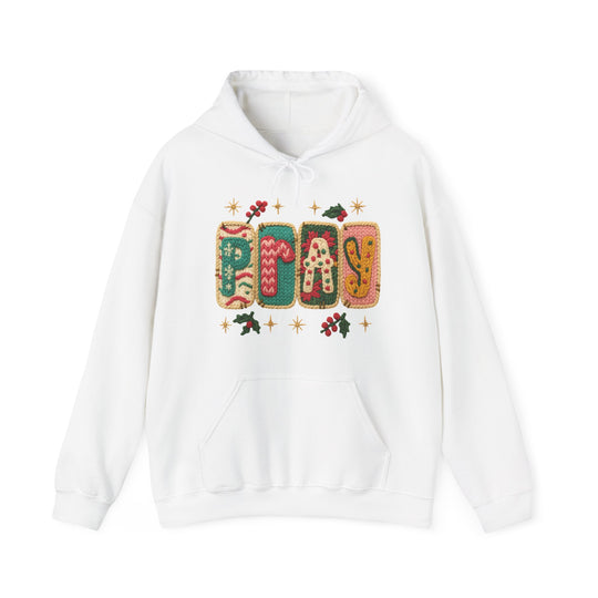 White Pray hoodie with holiday-themed knit graphic, kangaroo pocket, and drawstrings; cozy blend of cotton and polyester perfect for cold days.