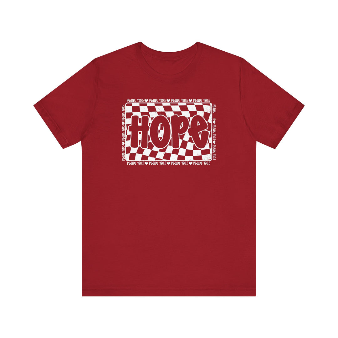 Hope Tee: A classic unisex red t-shirt featuring a white and red checkered design, crafted from soft cotton for a comfortable fit and durable wear.