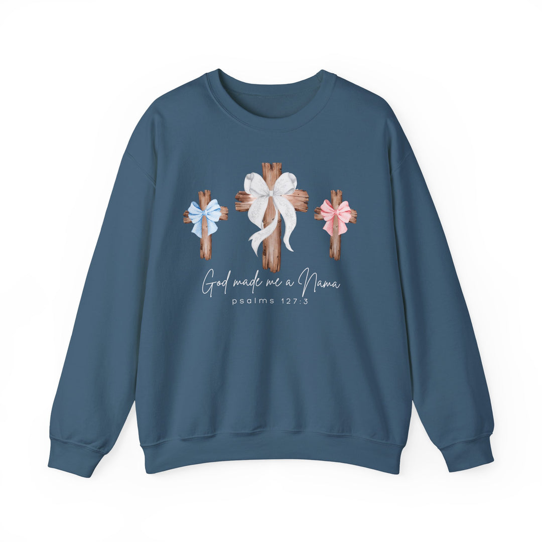 Blue crew-neck sweatshirt with wooden crosses graphic, bows, and God made me a Mama text, embodying comfort and faith from Faith Family Designs.