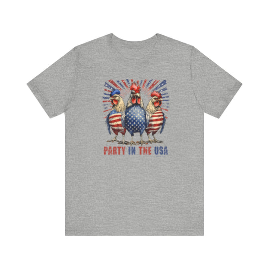 A Party In the USA Tee featuring a grey t-shirt with a red, white, and blue rooster design. Unisex jersey tee with ribbed knit collars, taping on shoulders, and 100% Airlume combed cotton.