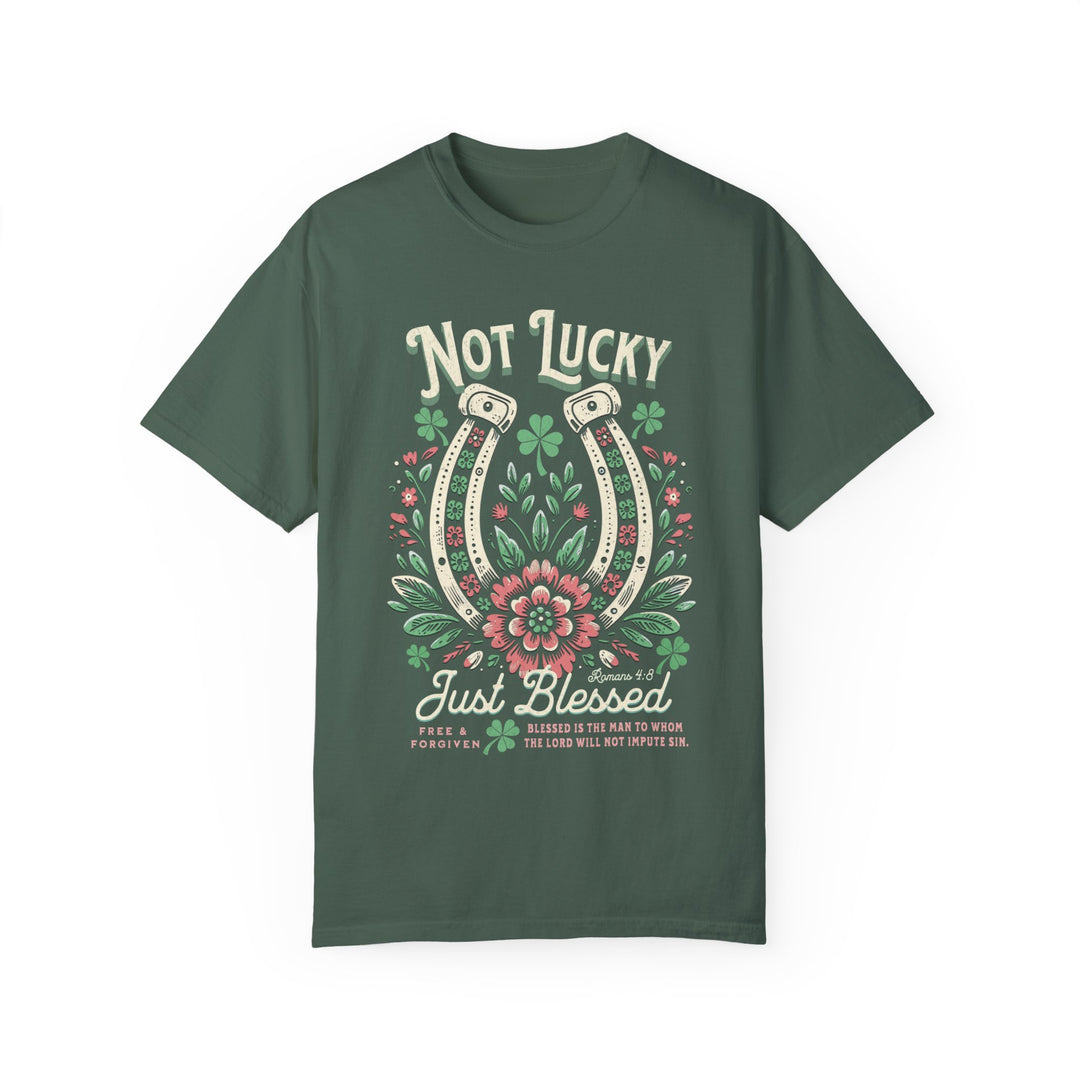 Blessed Tee: Green t-shirt featuring a graphic of a horseshoe surrounded by flowers, crafted from 100% ring-spun cotton for comfort and durability.