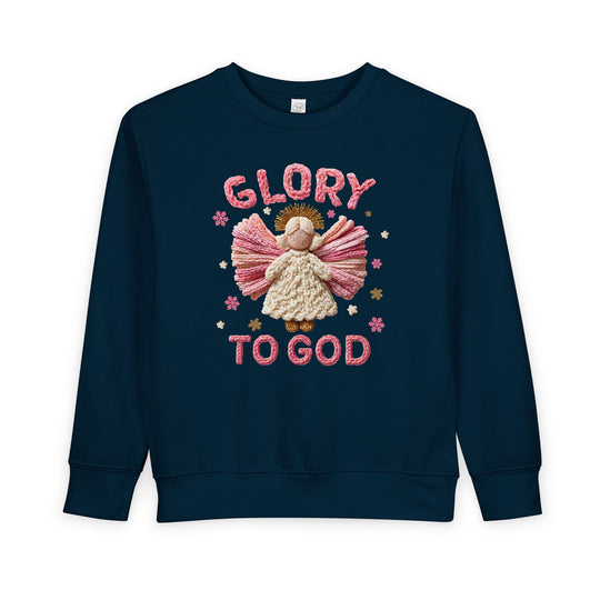 Navy-blue toddler crewneck featuring a Glory to God yarn-style angel graphic with cream, pink, and gold details, perfect for warmth and style.