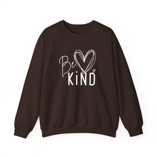 Dark-brown pullover sweatshirt with Be ♥ Kind graphic, combining hand-lettered text and heart doodle, offering unisex fit, comfort, and durability.