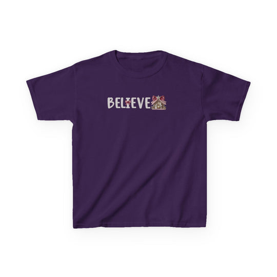 Believe Kids Tee, purple with BELIEVE in glittery font, featuring a poinsettia I and a gingerbread-house graphic. Made of durable, soft cotton.